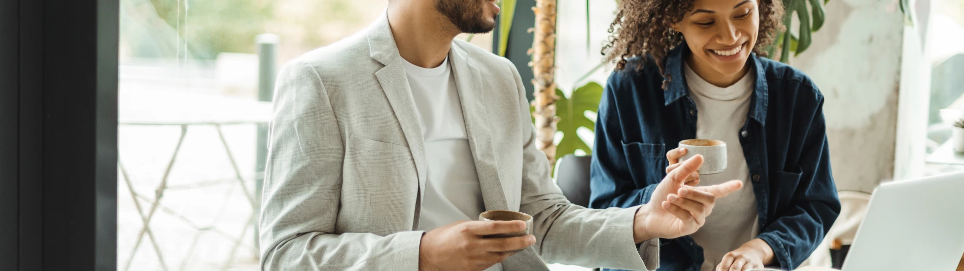 Confident Smiling Businesspeople Working Using Laptop