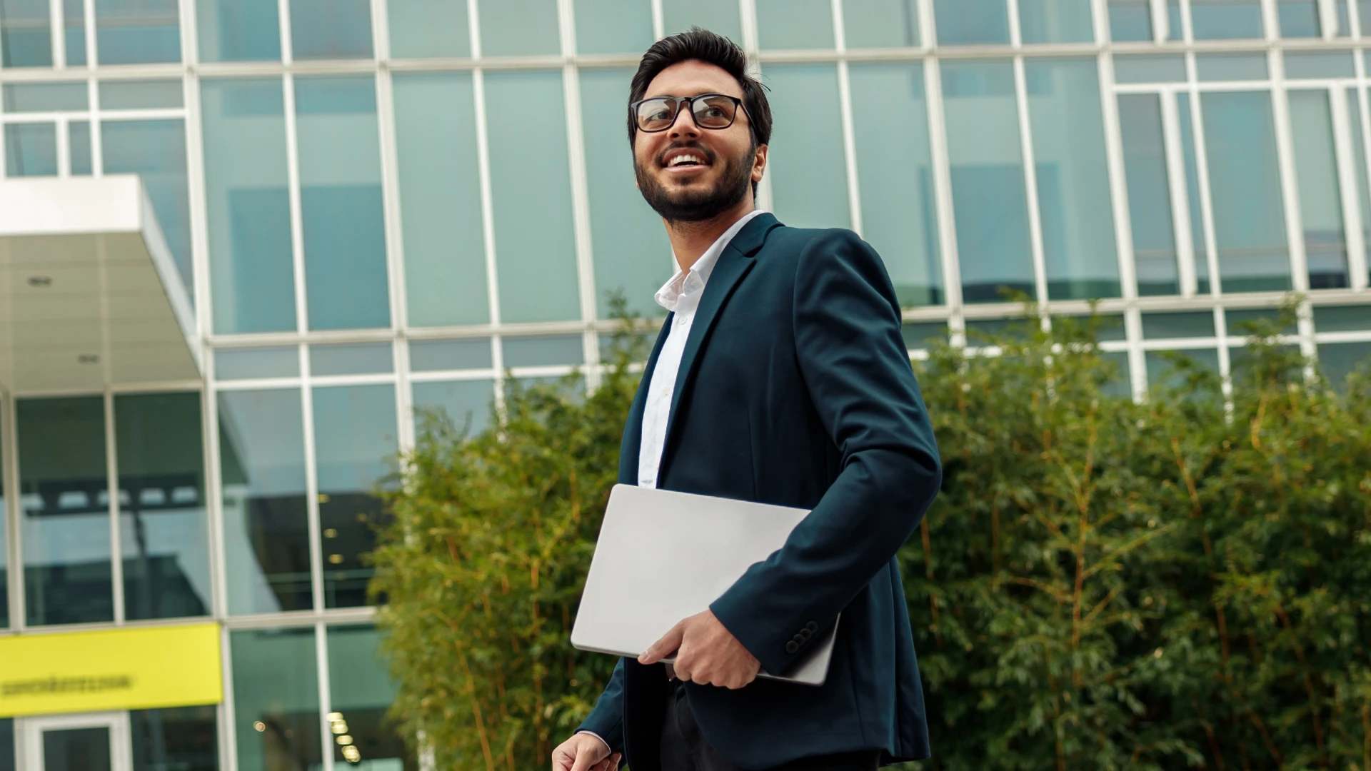 Indian businessman in front of a building