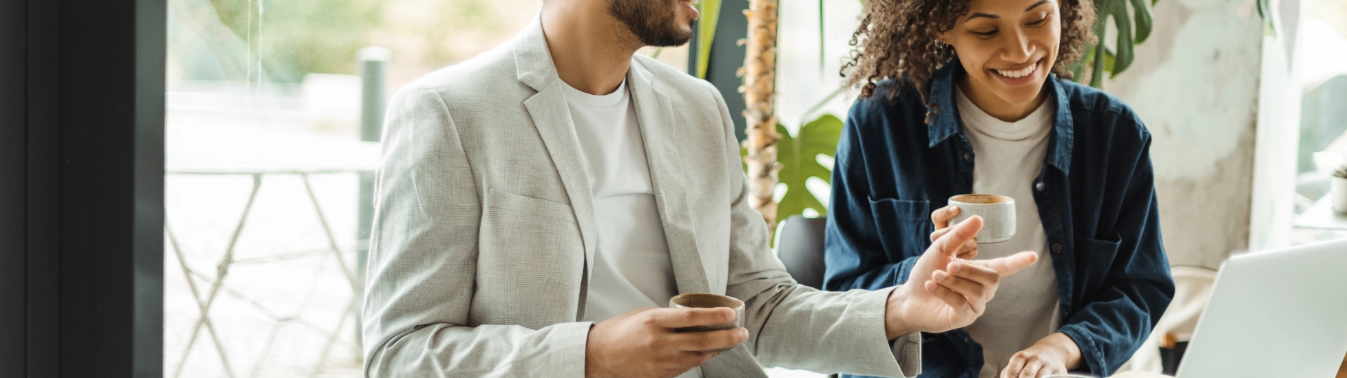 Confident Smiling Businesspeople Working Using Laptop